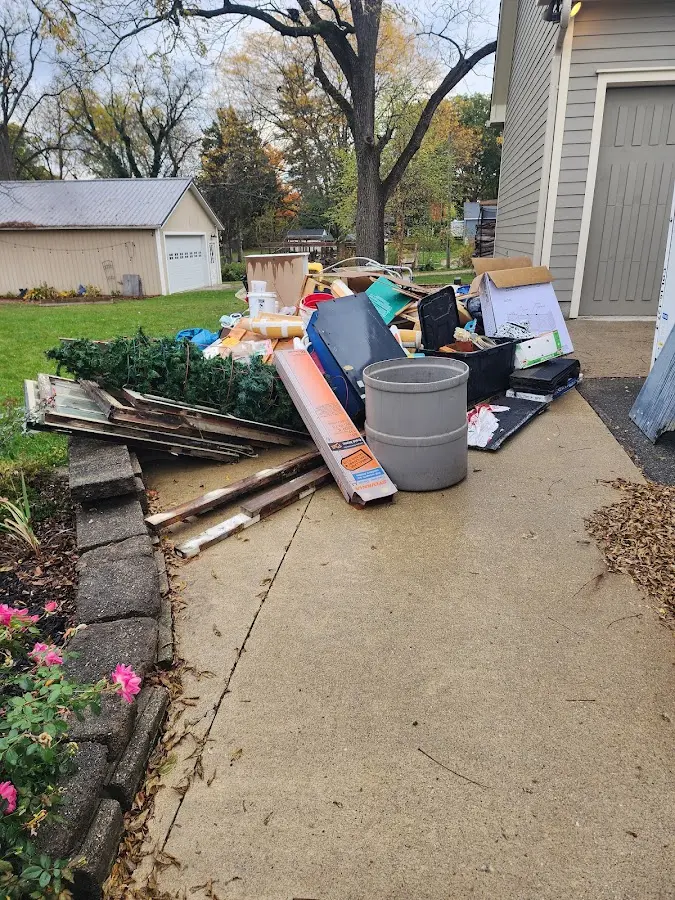 Dumpster being loaded with debris for 3 Yard Dumpster Rental in Rutland